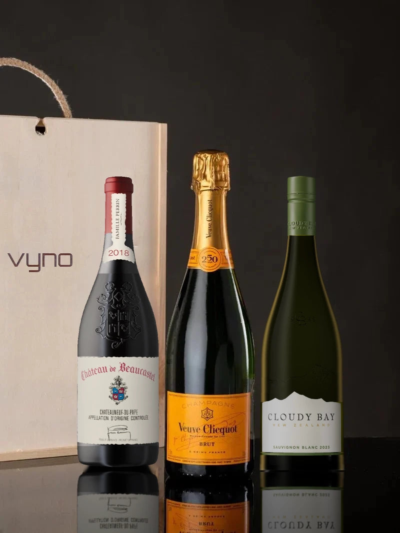 The Fusion Reserve Gift Set with Château de Beaucastel, Veuve Clicquot and Cloudy Bay beside a Vyno wooden gift box